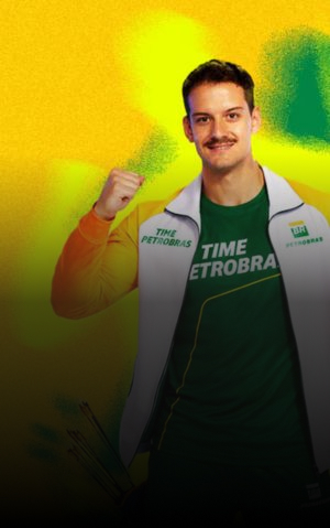 Atleta posa com uniforme esportivo verde e amarelo do Time Petrobras.