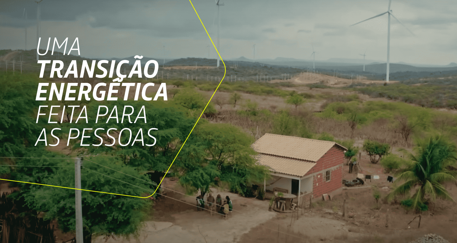 Imagem de uma área rural com turbinas eólicas ao fundo e uma casa simples à frente. Texto: 'Uma transição energética feita para as pessoas'.